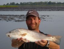Lowtide redfish i.e. exposed oyster bars in background