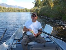 My son and I taking lunch in the drift boat on the south fork of the Snake River, Idaho