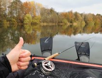 October fishing chill on a belly boat while fishing for pike on a streamer in a large flooded sandpit.