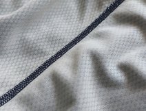 The inner surface and structure of the BugStopper® material of the hoody in dark blue Nightfall Heather.