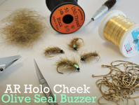 At The Vice - AR Holo Cheek Olive Seal Buzzer