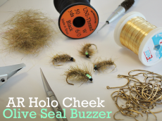 At The Vice - AR Holo Cheek Olive Seal Buzzer - Article