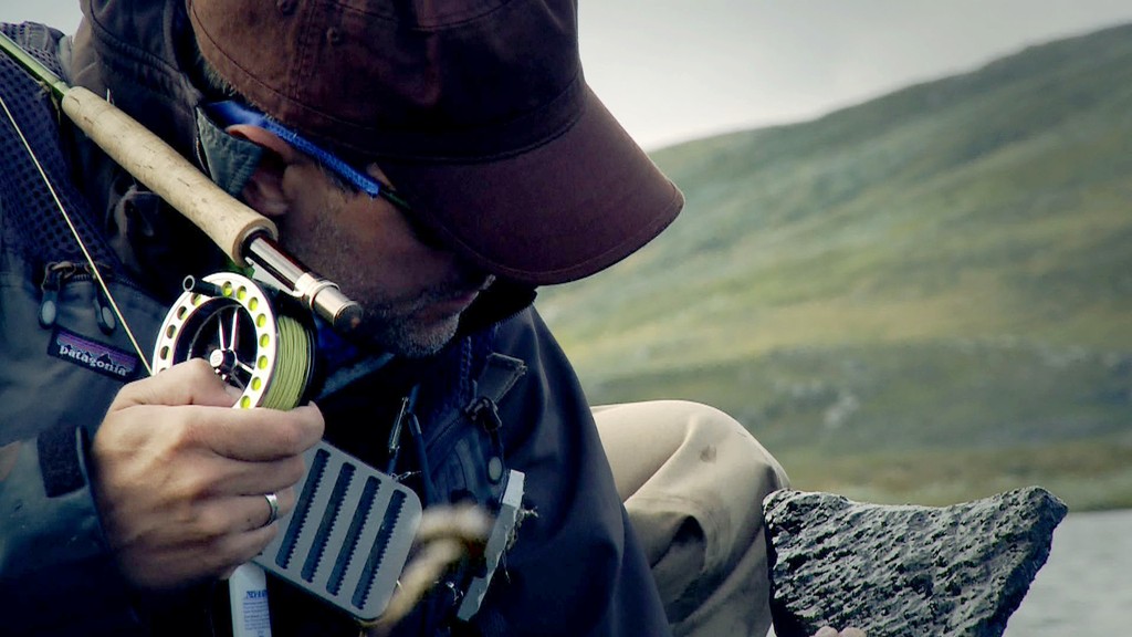 Lapland Sweden. Morten Oeland looking for nymphs under the rocks.
