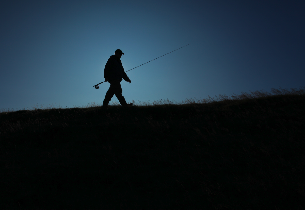 A fly fisher sets forth