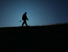 A fly fisher sets forth