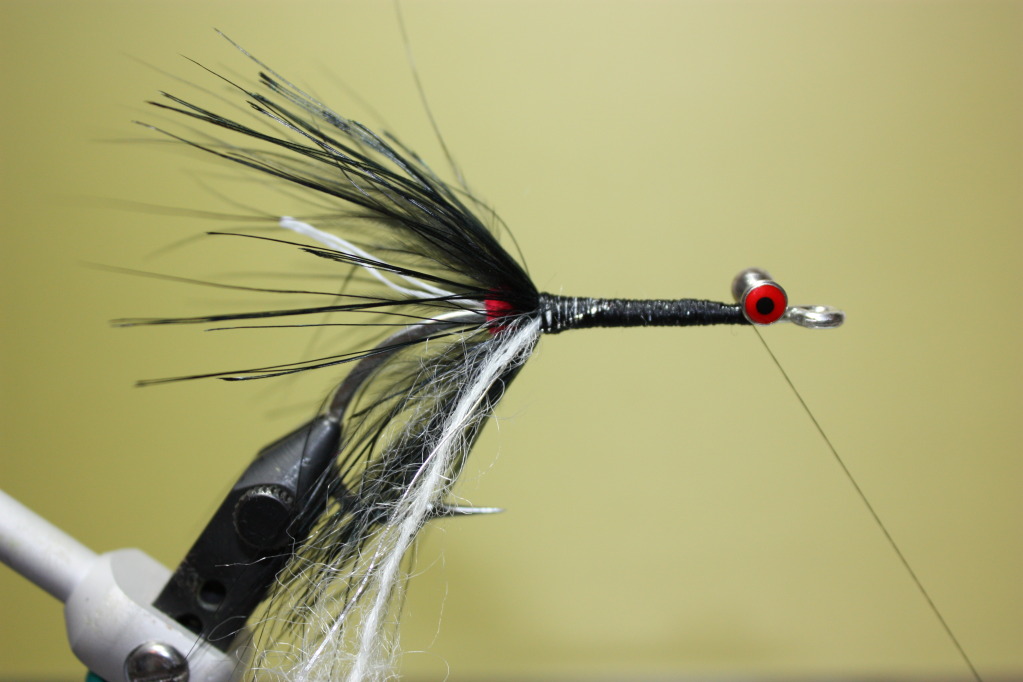 Tie in a piece of white mohair yarn and silver tinsel