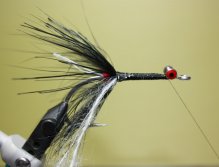 Tie in a piece of white mohair yarn and silver tinsel