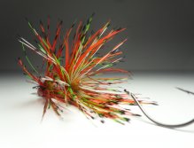 A ball of dubbing is used to prevent the hackle fibers from collapsing when wet