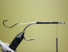 Bind down the Fireline. (Optional: Apply brushable superglue to the shank of the hook)