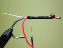 Tie in a length of small chenille. Make sure to strip the chenille to prevent bulk at the tie in point