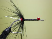 Tie in a piece of marabou by the tip. Fold back the fibers and wrap. Tie off