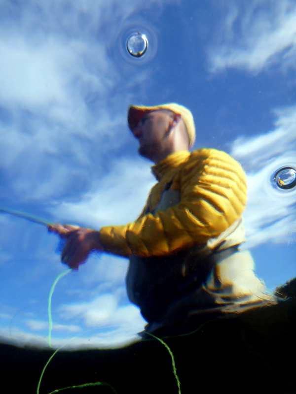 Bob Neal from underwater shoots his line back out.  The small bubbles acting like mini fish eye lenses to what is happening above