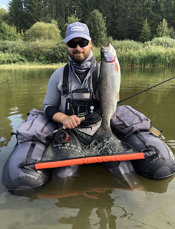 This nice rainbow was caught right in the middle of trout pond, where most of the bigger fish was! While the fishermen on the bank were almost with no strike, the belly boat was much more effective, although the behavior of the fish was very erratic!