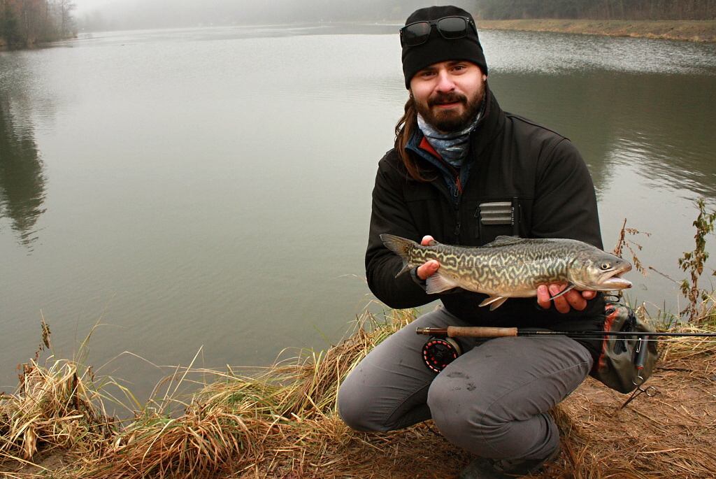 A nice catch of the "Tiger Fish" - a cross between a brown and brook trout. A less traditional catch is always a pleasure. But as you can see in my frozen face, it's time to say goodbye! See you in other articles & galleries! Ale� ;-)