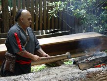 Usquetsiwo, (Cherokee Indian Sonny Ledford) making a dug out canoe from a large yellow poplar tree