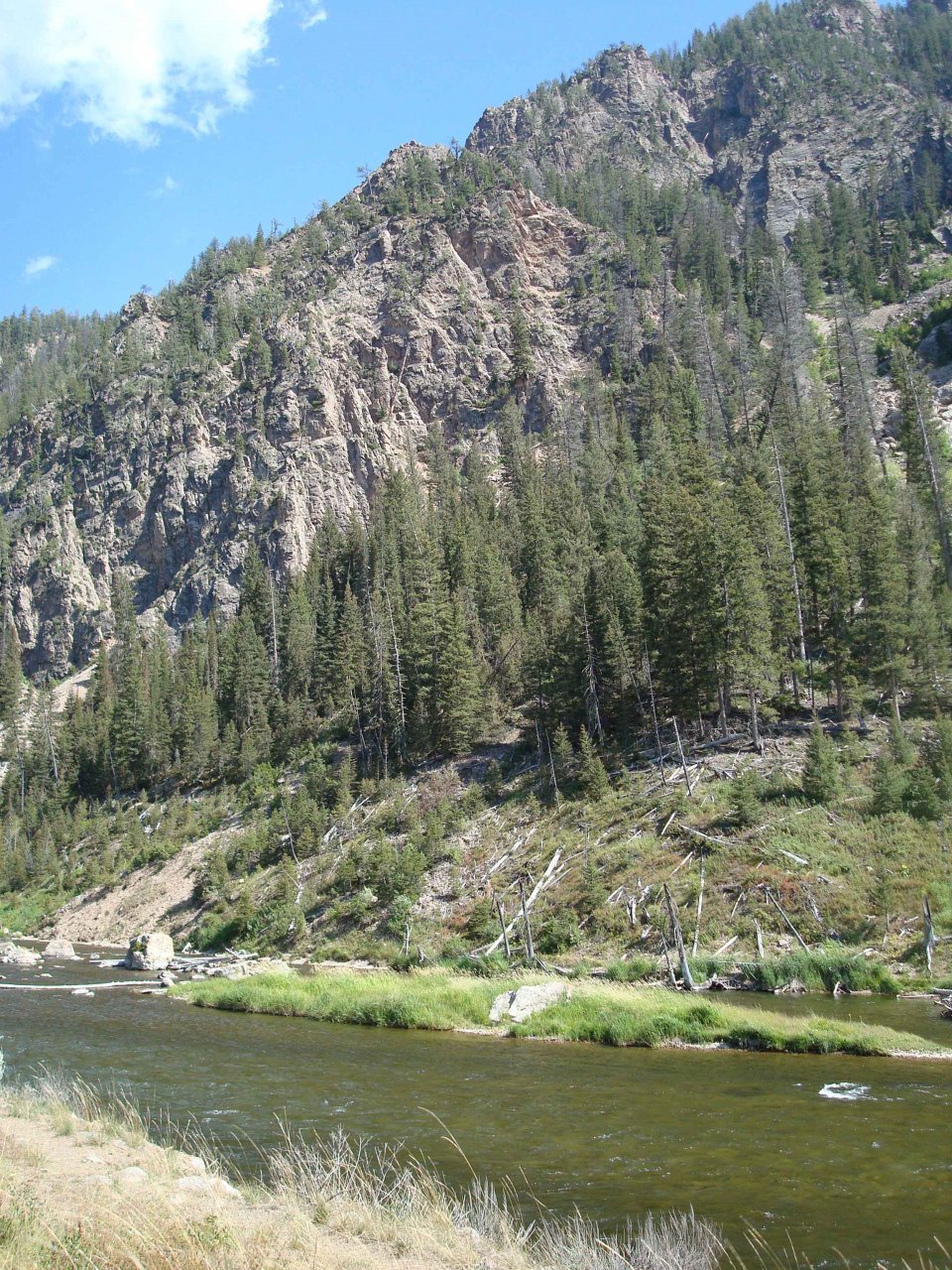 Madison River flowing by Escarpment