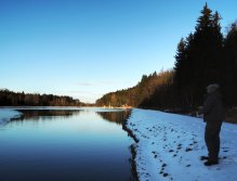 In this photo is shown all the above. A well and warmly dressed fisherman in quality footwear that protects his feet from the cold of the frozen ground, fishing tactically along the icy edge for the fish that hide under the icy water surface!